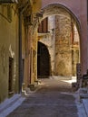 Narrow alley with decorated tunnel, in Pyrgi  medieval village, Chios island, Greece Royalty Free Stock Photo