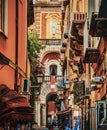 Narrow alley with Duomo steeple on the background in Sorrento Royalty Free Stock Photo