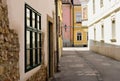 Narrow alley in European town. streetscape and old architecture. Royalty Free Stock Photo