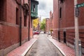 Narrow Alley in a historic residentail district on a cloudy autumn day Royalty Free Stock Photo