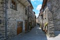 Narrow alley with houses from field stones in Virgoletta, a beautiful ancient mountain village, district of Villafranca in