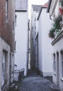 Narrow alley between many houses Royalty Free Stock Photo