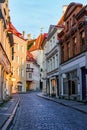 Narrow alley of medieval houses in the city of Tallinn at sunrise. Royalty Free Stock Photo