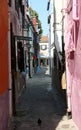 Narrow alley in the middle of houses in the island of Burano nea