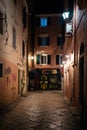 Narrow alley at night on Corfu island, Greece. Old town street at night Royalty Free Stock Photo
