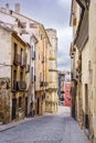 Narrow alley with old houses of many years in the city of Cuenca, Royalty Free Stock Photo