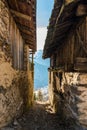 Narrow alley between old houses with mountain view