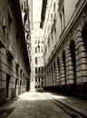 Narrow alley in old part of downtown Budapest. black and white photo. stucco exteriors and wood windows Royalty Free Stock Photo