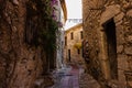 Narrow alley and old stone houses in Eze village in France Royalty Free Stock Photo