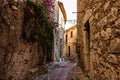 Narrow alley and old stone houses in Eze village in France Royalty Free Stock Photo