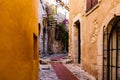 Narrow alley and old stone houses in Eze village in France Royalty Free Stock Photo