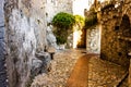 Narrow alley and old stone houses in Eze village in France Royalty Free Stock Photo