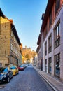 Narrow alley in the old town with a view of the Wernigerode Castle in the Harz Mountains