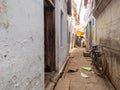 A narrow alley with a parked bicycle