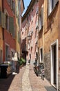 Narrow alley in the popular historic old town of Riva del Garda Royalty Free Stock Photo