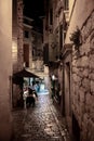 Narrow Alley With Small Bistro In The Old Town Of The City Of Rovinj In Istria In Croatia Royalty Free Stock Photo