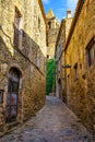 Narrow alleys with medieval stone houses in the old village of Madremanya, Girona. Royalty Free Stock Photo