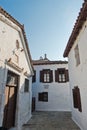 Narrow alleys with traditional greek white houses at Skiathos town, morning at Skiathos island