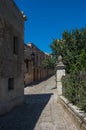 Narrow ancient cobblestone street of medieval town Erice, Sicily
