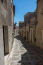 Narrow ancient cobblestone street of medieval town Erice, Sicily