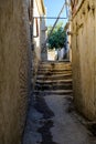 Narrow ancient pedestrian street with stairways in old town.