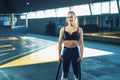 Narrow angle shot of a young woman working out with battle ropes. Copyspace background with athletics healthy composition