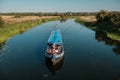 Narrow boat on River Nene at Woodford in Northamptonshire, England