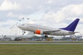 Modern airliner taking off from runway, airplanes on background Royalty Free Stock Photo