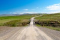 One-lane bride aolg a gravel coountry road on a clear summer day Royalty Free Stock Photo