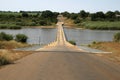 Narrow bridge over river Royalty Free Stock Photo