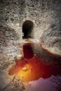 Narrow bridge under which the Tinto River passes, in Huelva, Spain, with its reddish waters Royalty Free Stock Photo