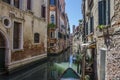 Narrow canal with old colorful houses in Venice, Italy Royalty Free Stock Photo