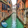 Narrow canal in Venice (Italy)