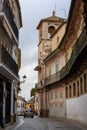 Narrow city street in the historic city center of Ecija with the Marquis of Penaflor Palace