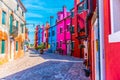 Blue, red, green and purple house facade in the island of Burano, Venice