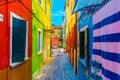 Blue, red, green and purple house facade in the island of Burano, Venice