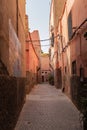 Narrow cobble stone street in Medina suburb in Marrakesh, Morocco