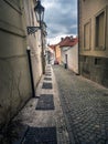 Narrow cobble street in Prague Royalty Free Stock Photo