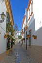 Narrow cobbled colourful back street in Estepona Spain Royalty Free Stock Photo