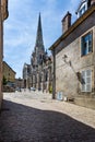 Narrow cobbled street leading to Autun Cathedral in Autun, Burgundy, France