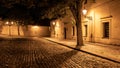 Narrow cobbled street in old medieval town with illuminated houses by vintage street lamps, Novy svet, Prague, Czech Royalty Free Stock Photo