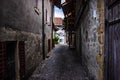 Narrow cobbled street in an old town Royalty Free Stock Photo