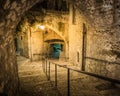 Narrow cobbled street in old town at night, France. Royalty Free Stock Photo