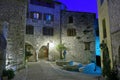 Narrow cobbled street in old town Peille at night Royalty Free Stock Photo