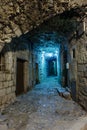 Narrow cobbled street in old town Peille at night, . Royalty Free Stock Photo