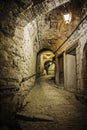 Narrow cobbled street in old town Peille at night, France. Royalty Free Stock Photo