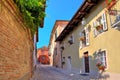 Narrow cobbled street in town of Guarene, Italy. Royalty Free Stock Photo