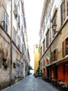 Narrow cobbled street typical of Rome called