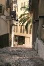 Narrow cobbled street with vintage street light in Benidorm