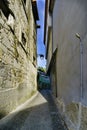 Narrow cobblestone alley if people in the center of Porto Portugal with facades Royalty Free Stock Photo